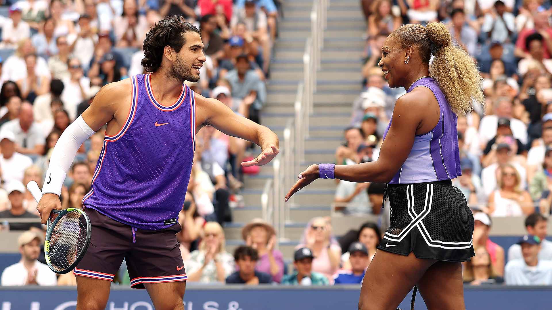 Carlos Alcaraz and Serena Williams compete inside Arthur Ashe Stadium on Tuesday.